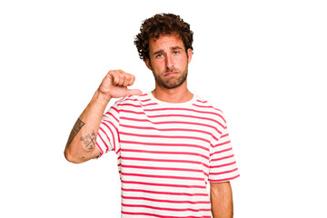 Obraz premium Young caucasian curly hair man isolated Young caucasian man with curly hair isolated showing a dislike gesture, thumbs down. Disagreement concept.