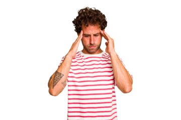 Young caucasian curly hair man isolated Young caucasian man with curly hair isolated touching temples and having headache.