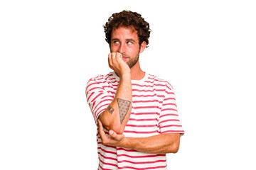 Young caucasian curly hair man isolated Young caucasian man with curly hair isolated biting...