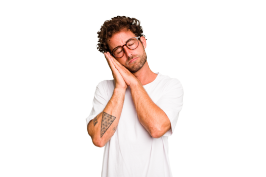 Young caucasian curly hair man isolated Young caucasian man with curly hair isolated yawning showing a tired gesture covering mouth with hand.