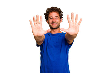 Young caucasian curly hair man isolated Young caucasian man with curly hair isolated showing number ten with hands.