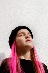 Beautiful teenage girl wear black beanie posing in city.