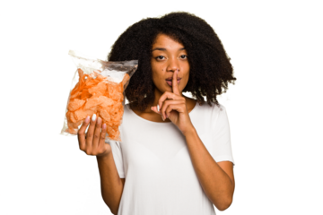 Young African american man holding crips isolated keeping a secret or asking for silence.