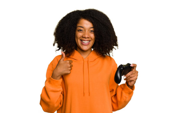 Young African American woman holding a game controller isolated smiling and raising thumb up