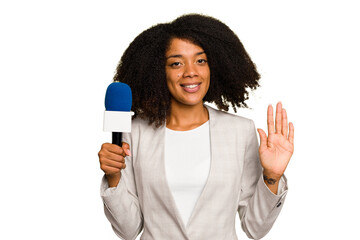 Fototapeta na wymiar Young TV presenter African American woman with a microphone isolated smiling cheerful showing number five with fingers.