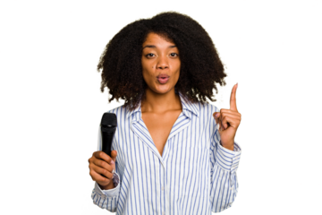 Young African American singer woman holding a microphone isolated having some great idea, concept of creativity.