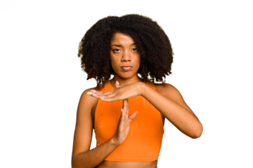Young African American woman isolated showing a timeout gesture.