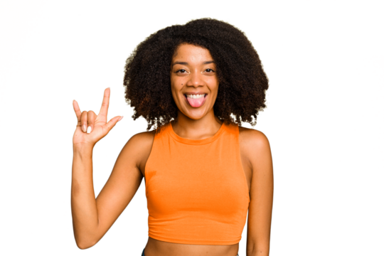 Young African American woman isolated showing a horns gesture as a revolution concept.