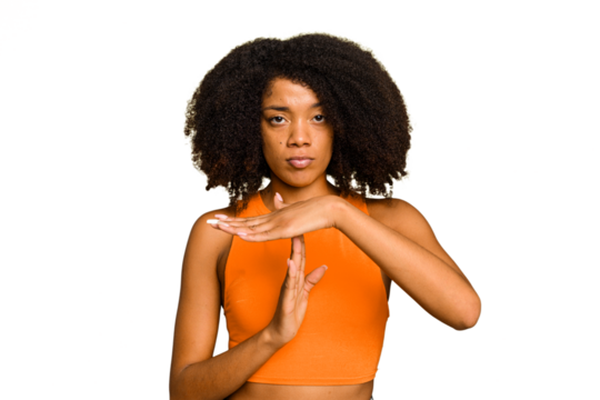 Young African American woman isolated showing a timeout gesture.