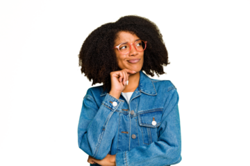 Young African American woman isolated relaxed thinking about something looking at a copy space.