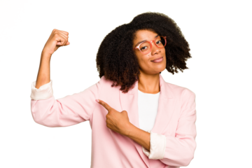 Young African American woman isolated showing strength gesture with arms, symbol of feminine power