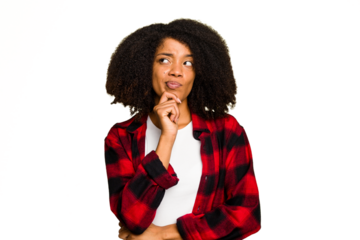 Young African American woman isolated looking sideways with doubtful and skeptical expression.