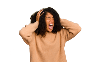 Young African American woman isolated covering ears with hands trying not to hear too loud sound.