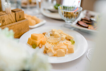 cheese on a plate on the table