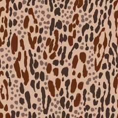 Animal mix seamless pattern. Hand drawn leopard, cheetah, jaguar stains. Beige and brown colored camouflage background