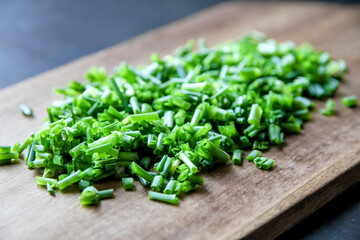 Fresh cut chives on a cutting board