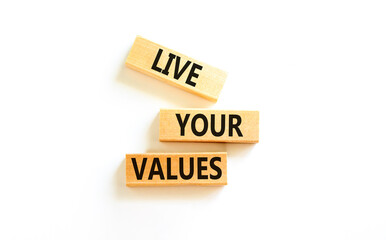Live your values symbol. Concept words Live your values on wooden blocks. Beautiful white table white background. Business, psychological and live your values concept. Copy space.