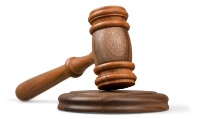 Wooden gavel on wooden table, on  background