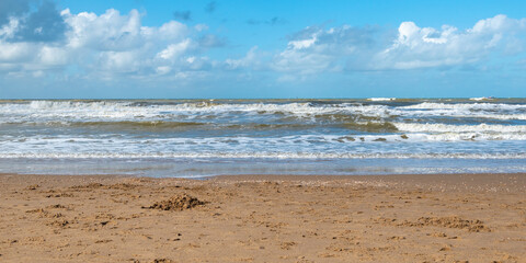Fototapeta na wymiar Dutch coast, North Sea, beach in The Netherlands.