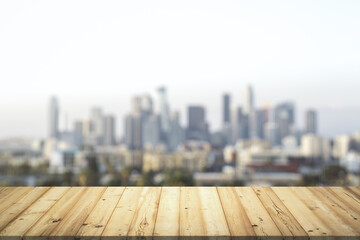 Table top made of wooden dies with blurry city view on background, template