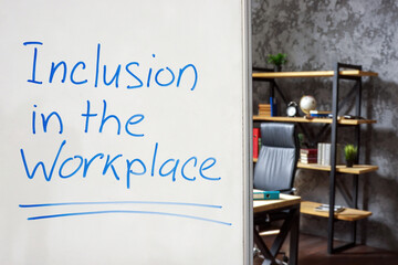 Whiteboard with Inclusion in the workplace sign.