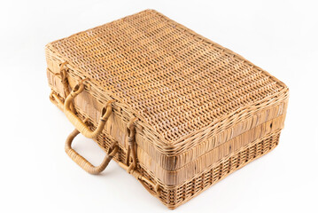 This bag in the shape of a suitcase is woven of wood.