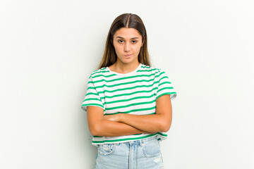 Young Indian woman isolated on white background frowning face in displeasure, keeps arms folded.