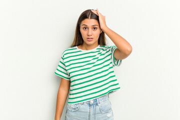 Young Indian woman isolated on white background being shocked, she has remembered important meeting.