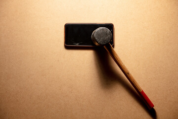 Broken phone with hammer
