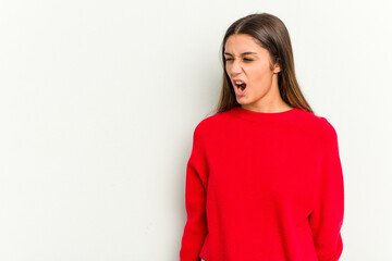 Young Indian woman isolated on white background shouting very angry, rage concept, frustrated.