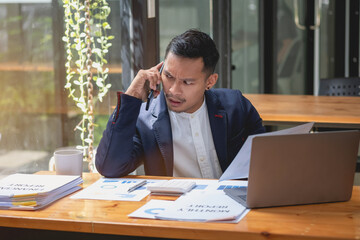 Marketing, Financial, Accounting, Planning, businessman uses a mobile phone to contact a customer to inform her of the company is business partnership.