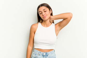 Obraz premium Young Indian woman isolated on white background having a neck pain due to stress, massaging and touching it with hand.