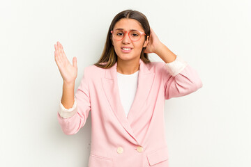 Young Indian woman isolated on white background screaming with rage.
