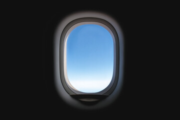Airplane window with blue sky.