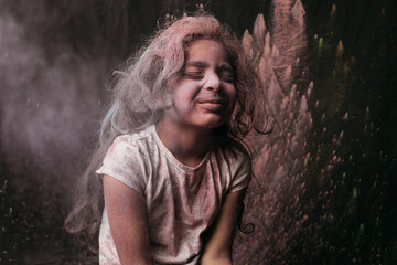 Portrait of a girl celebrating holi