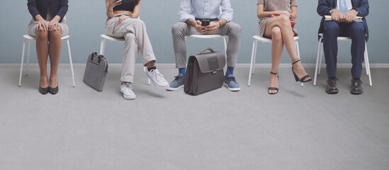 People sitting and waiting for a job interview