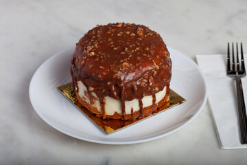German Berliner Chocolate Cake With Banana on a White Plate