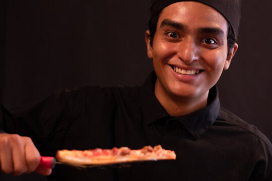 Enthusiastic Chef Offers You The Food He Prepared With A Big Smile On His Face