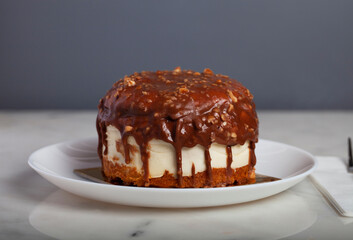 German Berliner Chocolate Cake With Banana on a White Plate