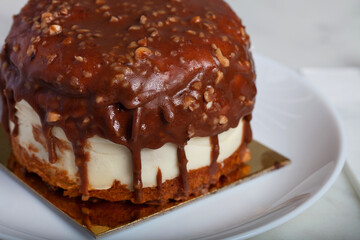 German Berliner Chocolate Cake With Banana on a White Plate