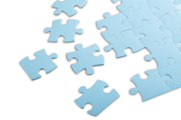 Blue puzzle pieces on grey background
