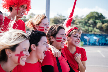 Obraz premium Group of fans celebrating together the victory of their team in the championship