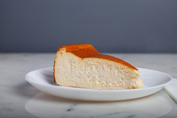 San Sebastian Cheesecake Slice on a White Plate