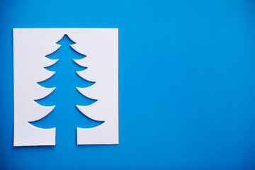 Fototapeta na wymiar Christmas tree paper cutting design papercraft card.