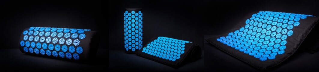  Set of Acupuncture blue mat with many plastic spikes on black background. Alternative therapy and...