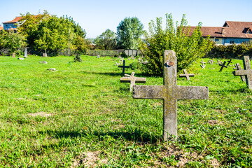 The old military cemetery at Tranžament, Petrovaradin. A panoramic view of the old identical, neglected concrete gravestone crosses of the military cemetery.