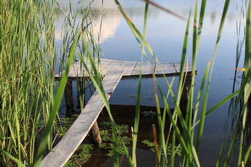 Wooden bathing platform on the lake