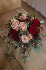 brides bouquet of red and pink roses