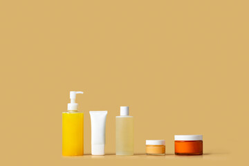 Cosmetic product  cleanser, gommage, toner, cream, spf, on packaging on beige background.