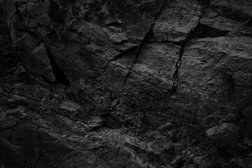 Black white rock texture with cracks. Rough surface mountain surface. Close-up. Dark grey. Stone...